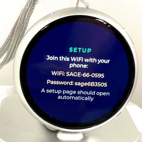 Device screen showing SETUP, join this WiFi with your phone, with a WiFi network name and password