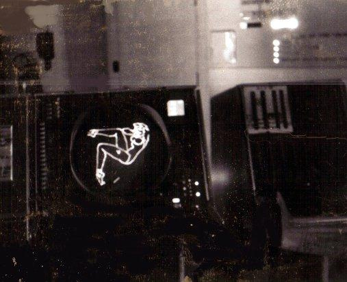 The single recovered image found on the tape — a pin-up girl on a display scope